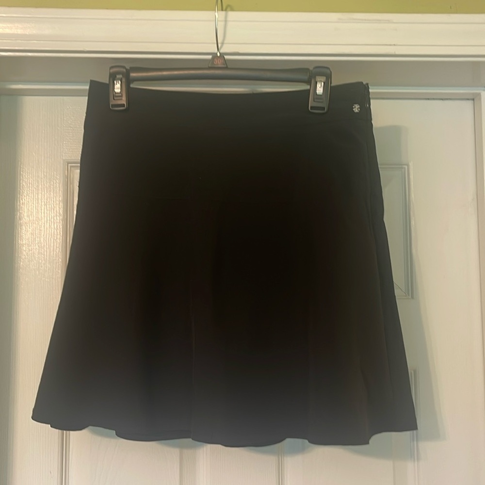 Izod Golf - black skort - back waist pocket with zipper - size 4